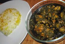 Ghormeh Sabzi with chicken in a bowl, served with rice