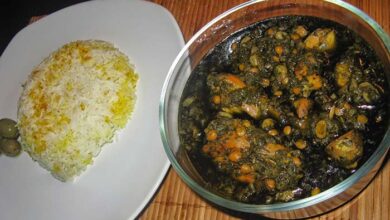 Ghormeh Sabzi with chicken in a bowl, served with rice
